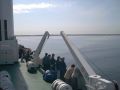 Click for Fullsize. (600 x 450) Tallinn comes in sight with several people lined up at the railing. (June 2003) Photo: Johann Hinterberger